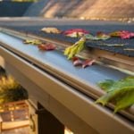 KGuard gutter installed on home. brown color cutter has leaves on it