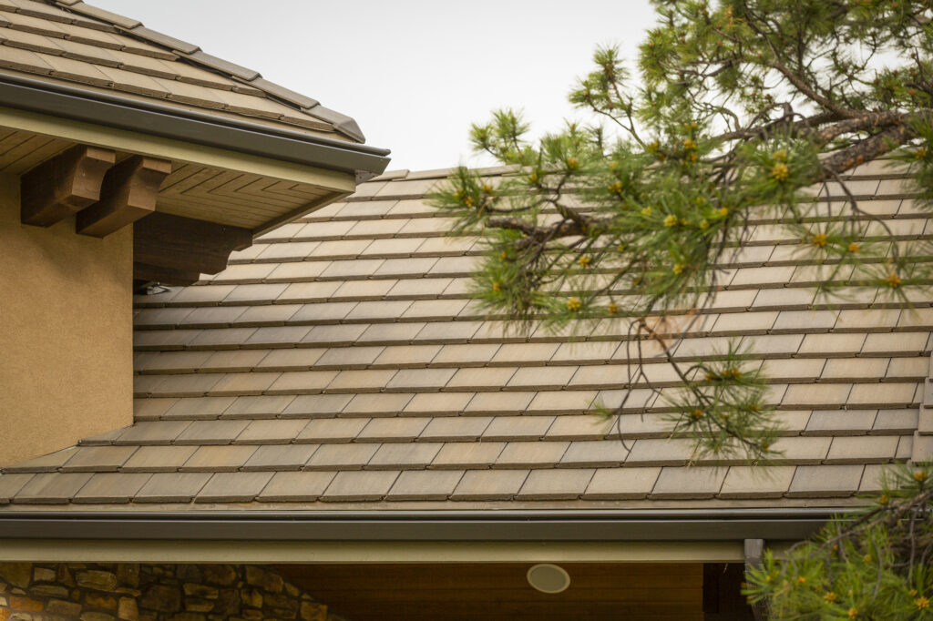 Residential Roof with Pine Tree Branches Nearby - K-Guard Rocky Mountains