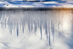 image of icicles melting, a common occurrence during freeze-thaw cycles