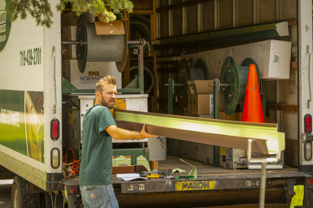 Ladi printing gutters. KGuard leaf free gutter trough being fabricated on-site. royal brown gutter. Seamless gutter. Better than Sectional Gutter. Made to size. Made specifically for your home. Bespoke Gutters