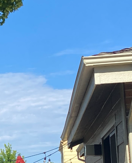 5 inch k-style gutter. 5" open gutter. k-style gutter profile. Dented trough. Seamed gutter. Separating seam. hail damaged gutter. KGuard Rocky Mountains before photo. KGRMS customer.