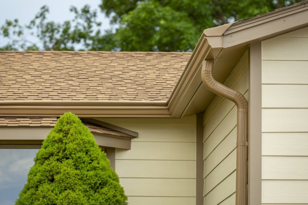 Seamless K-Guard gutter and downspout carrying roof runoff away from a Colorado home
