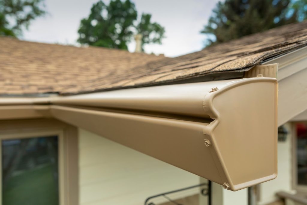 hooded gutter system installed by a gutter company in Colorado Springs on a tan Front Range home