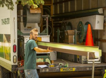 Ladi printing gutters. KGuard leaf free gutter trough being fabricated on-site. royal brown gutter. Seamless gutter. Better than Sectional Gutter. Made to size. Made specifically for your home. Bespoke Gutters