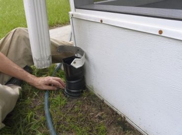 Downspout to Underground Drain. Not connected to underground drain. Spraying water into UGA can test if it's clogged.