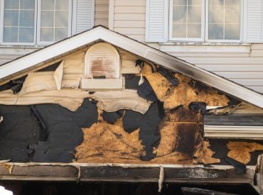 A,Close-up,View,Of,A,Neighborhood,Garage,Roof,,Which,Bears